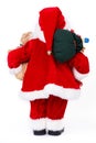 Santa Claus with Christmas gifts, back view. Royalty Free Stock Photo