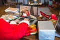 Santa claus with christmas presents having video call with happy caucasian family Royalty Free Stock Photo