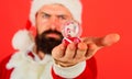 Santa Claus with Christmas snowglobe in hand. Christmas toy. New Year decoration. Bearded man with crystal ball. Royalty Free Stock Photo