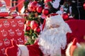 Santa claus at christmas in winter on the street is waiting for children in his arms, Moscow, January 7, 2022 Royalty Free Stock Photo