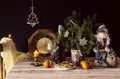 The Santa Claus, clock, tangerines, christmas cookies and champagne Royalty Free Stock Photo