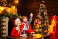 Santa claus coming. Mother and little child boy adorable friendly family having fun. Family having fun at home christmas Royalty Free Stock Photo