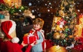 Santa claus coming. Mother and little child boy adorable friendly family having fun. Family having fun at home christmas Royalty Free Stock Photo