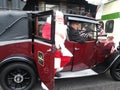 Santa claus coming out of a vintage cab Royalty Free Stock Photo