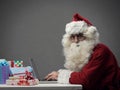 Santa Claus connecting with his laptop Royalty Free Stock Photo