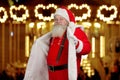 Santa Claus demonstrating his suit.