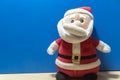 Santa Claus doll on blue background