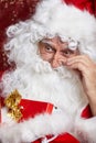 Santa Claus drinking tea Closeup Portrait Isolated on red Royalty Free Stock Photo