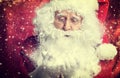 Santa Claus drinking tea Closeup Portrait Isolated on red Royalty Free Stock Photo