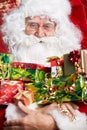 Santa Claus drinking tea Closeup Portrait Isolated on red Royalty Free Stock Photo