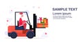 Santa claus driving forklift truck loading colorful gift present boxes merry christmas happy new year holiday Royalty Free Stock Photo