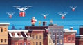 Santa claus with elves on roof hold controller drone delivery present service happy new year merry christmas holiday Royalty Free Stock Photo