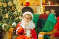 Santa Claus enjoying in served gingerbread man cake and milk. Christmas cookies. Cookies for child Santa Claus. Milk and