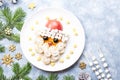 Santa Claus face made of fruits and marshmallow on a plate. Christmas food for children. Top view Royalty Free Stock Photo