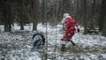 Santa Claus is fighting in the woods with robbers. Slow motion