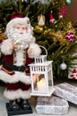 Santa Claus figurine with candle holder at Xmas tree