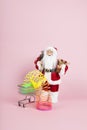 Santa Claus pink shopping trolley with rainbow