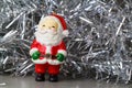 Santa Claus figurine and silvery tinsel