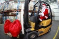 Santa Claus forklift operator in warehouse Royalty Free Stock Photo