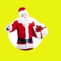 Santa Claus with gift posing on color white green