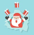 Santa Claus with gift in ripped paper hole Royalty Free Stock Photo