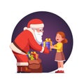 Santa Claus gives gift box to cute little girl kid Royalty Free Stock Photo