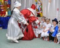 Santa Claus giving presents to children Royalty Free Stock Photo