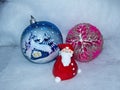 Santa Claus and glass balls. New Year`s toys. Festive background. Happy Christmas and New year! Royalty Free Stock Photo