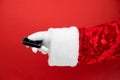 Santa Claus hand holds car keys. Merry Christmas and New Year concept. New car smart key. Buyer, property, buy, rent, sale, truck Royalty Free Stock Photo