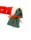 Santa Claus hand holds green sack full of presents