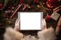 Santa Claus hands holding blank digital tablet Royalty Free Stock Photo