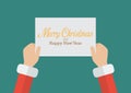 Santa Claus hands holding a Merry Christmas and Happy new year s Royalty Free Stock Photo