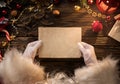 Santa Claus hands holding, reading blank letter