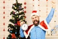 Santa Claus with happy winners face near Christmas tree Royalty Free Stock Photo