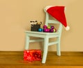 Santa claus hat on chair with presents Royalty Free Stock Photo