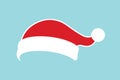 Santa Claus hat flat. Realistic Santa Claus hat isolated blue background. Red funny cap silhouette. Merry Christmas Royalty Free Stock Photo