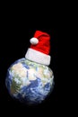 Santa Claus hat on globe Royalty Free Stock Photo