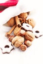 Santa Claus hat with nuts, spices and chocolates. Christmas background Royalty Free Stock Photo