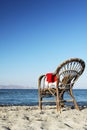 Santa Claus hat on of rattan chair stand beach Royalty Free Stock Photo