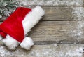 Santa Claus hat on vintage wooden boards christmas background Royalty Free Stock Photo