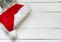 Santa Claus hat on white wooden boards Royalty Free Stock Photo