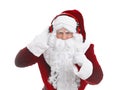 Santa Claus with headphones listening to Christmas music on white background Royalty Free Stock Photo