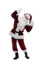 Santa Claus with headphones listening to Christmas music on white background Royalty Free Stock Photo