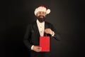 Santa Claus is here to fill everyones wish. Happy businessman with santa look. Bearded man hold shopping bag. Christmas Royalty Free Stock Photo