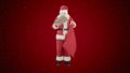 Santa Claus with his sack of lots of presents on red background with snow Royalty Free Stock Photo