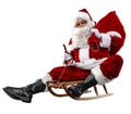 Santa Claus on his sleigh with a sack with presents. White background. Royalty Free Stock Photo