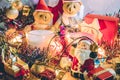 Santa claus hold bell and christmas candle, couple teddy bears and Ornament decorate Merry Christmas , happy new year