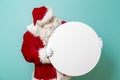 Santa Claus holding blank cardboard circle