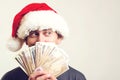 Santa claus holding cash, isolated on white. Christmas shopping time. Christmas, holidays, winning, currency and people concept. Royalty Free Stock Photo