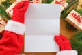 Santa Claus holding an empty wish list in his hands Royalty Free Stock Photo